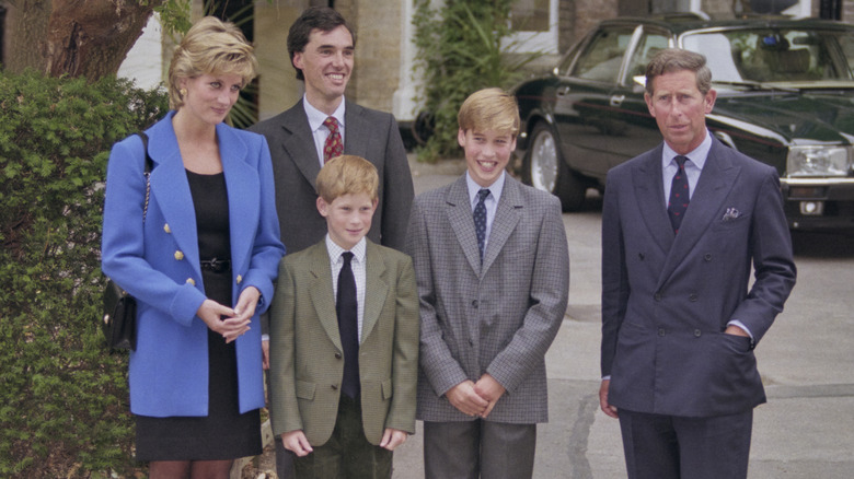 Prince Harry standing with his family