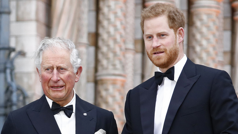 King Charles standing with Prince Harry