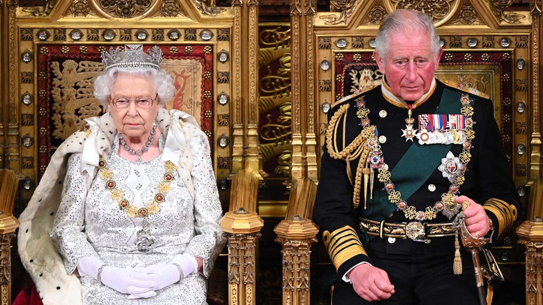 Prince Charles and Queen Elizabeth on their thrones 