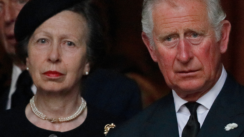 Princess Anne, King Charles in black