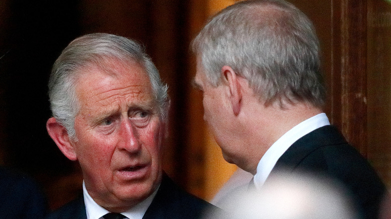 Prince Charles and Prince Andrew talking