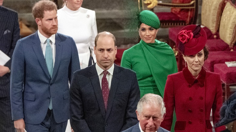 The royal family walking in a chapel