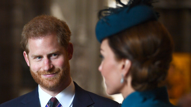 Prince Harry smiling at Kate Middleton