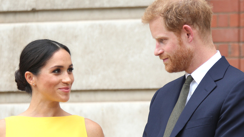 Meghan Markle and Prince Harry looking at each other