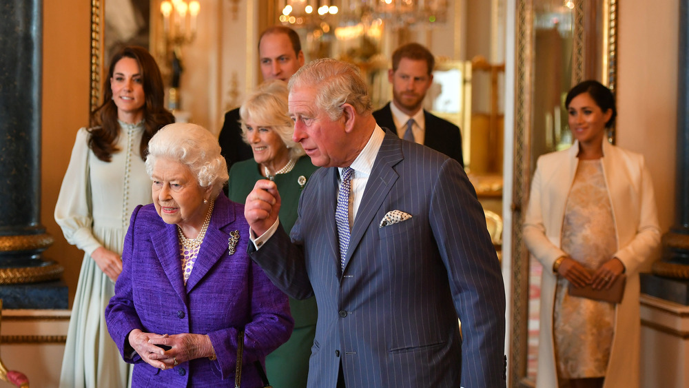 The royal family in a hallway