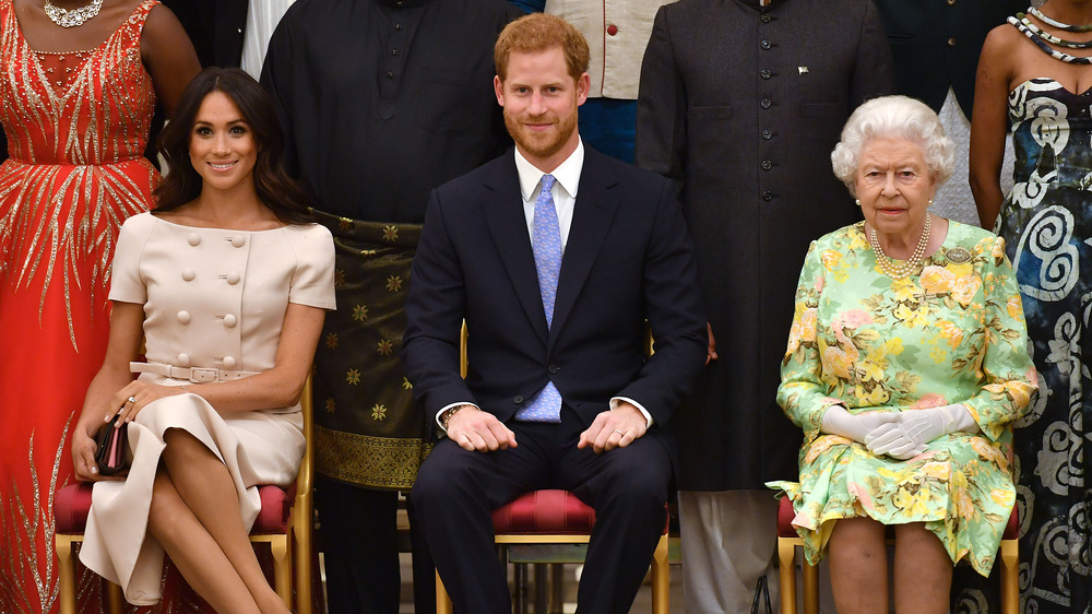 Meghan Markle, Prince Harry, and Queen Elizabeth sitting down