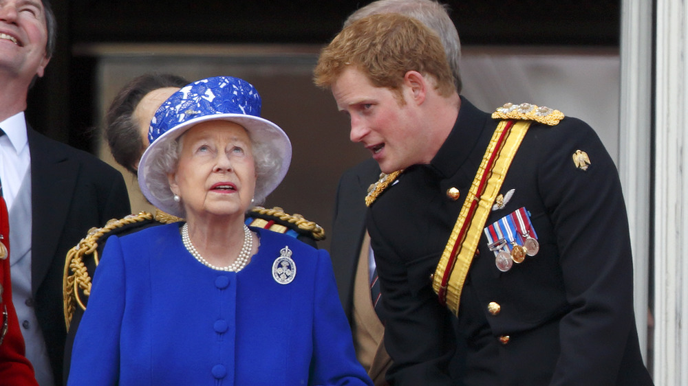 Prince Harry and Queen Elizabeth having a conversation