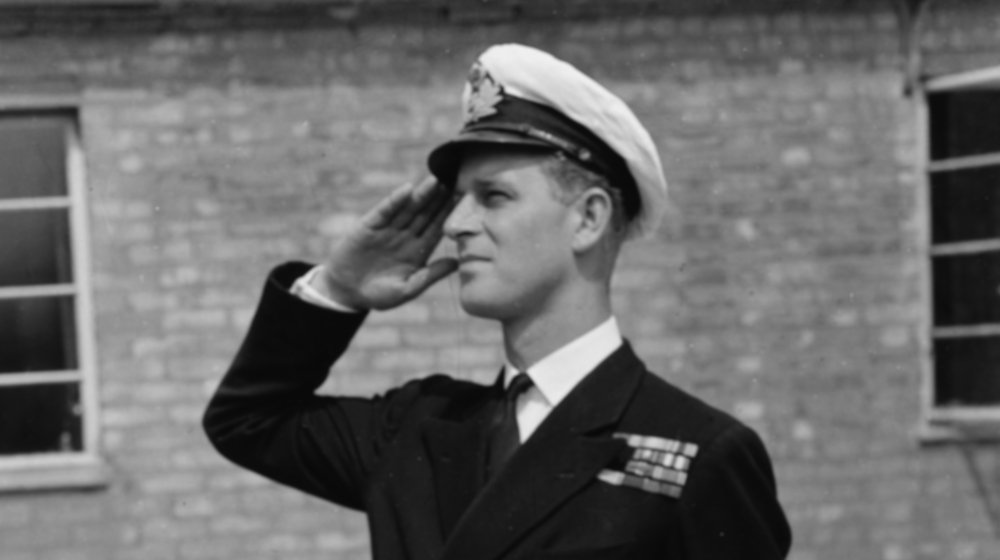 Prince Philip giving a salute in 1947