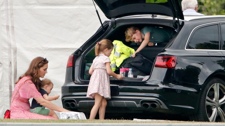 Kate Middleton and her kids getting into a car