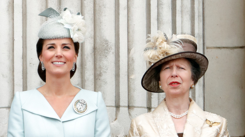 Princess Anne and Kate Middleton looking into the distance