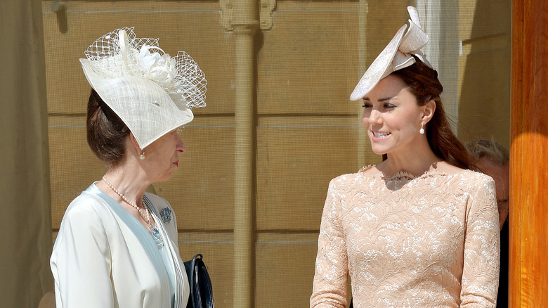 Kate Middleton and Princess Anne wearing fascinators