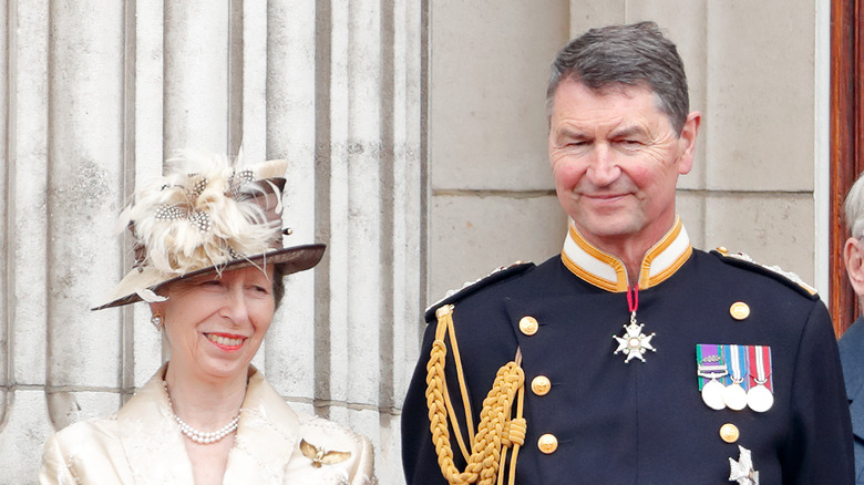 Timothy Laurence posing with Princess Anne, both smiling