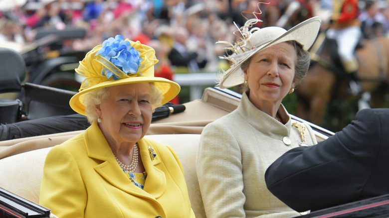 Queen Elizabeth and Princess Anne riding in a car