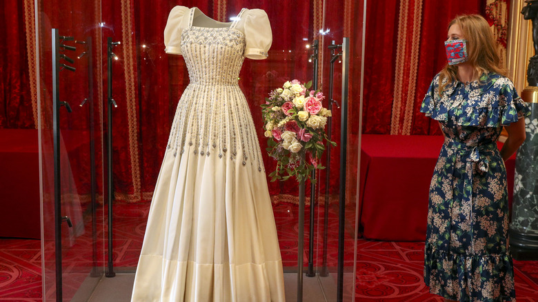 Princess Beatrice looking at her wedding dress on display