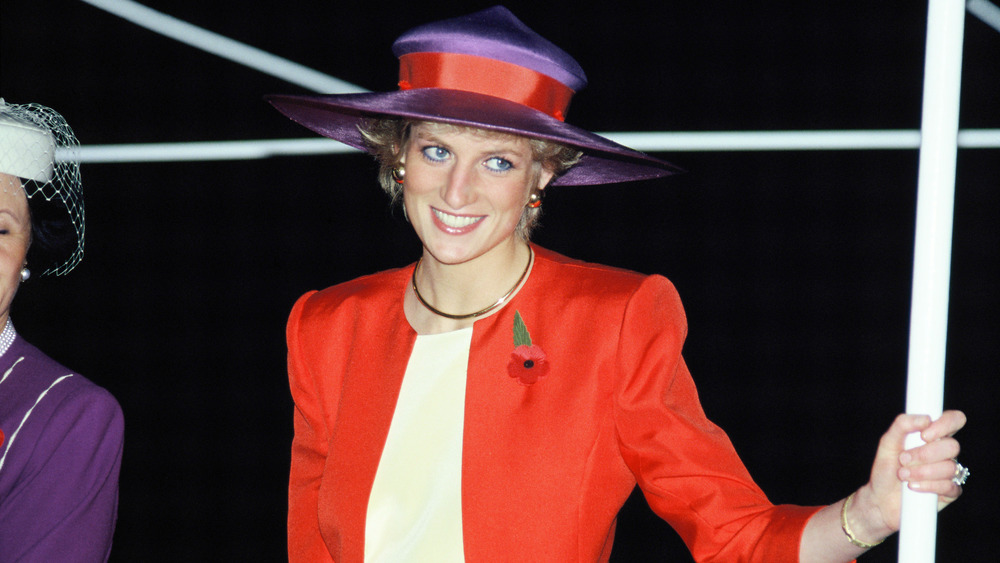 Princess Diana wearing red and purple