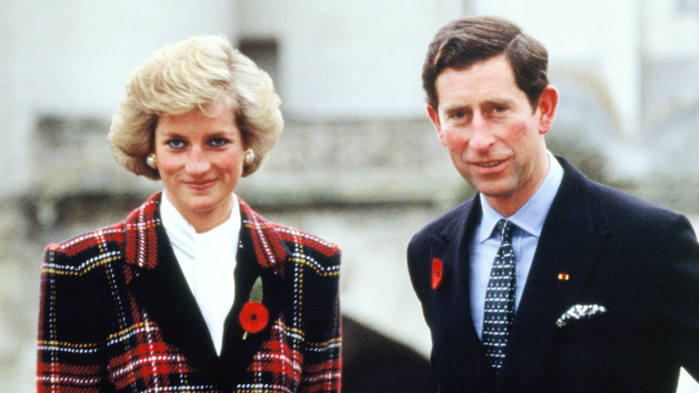 Princess Diana and Prince Charles outside a building