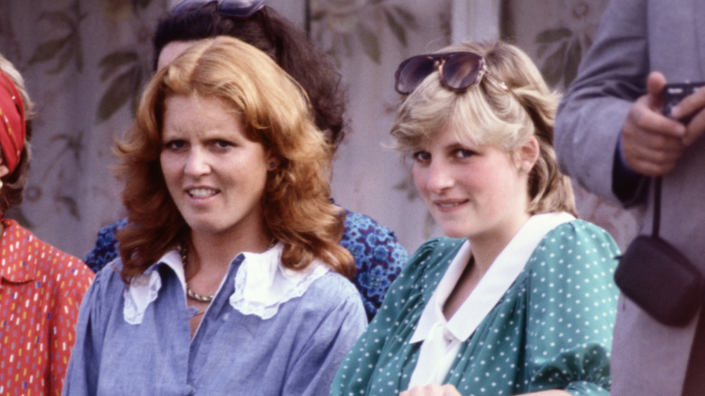 Sarah Ferguson and Princess Diana sitting next to each other at an event