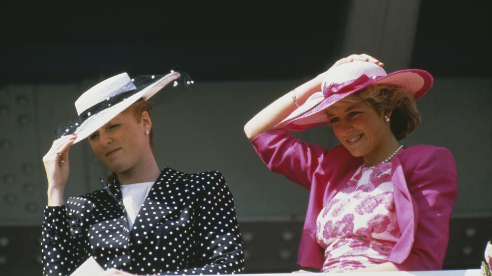 Sarah Ferguson and Princess Diana wearing black and pink, respectably