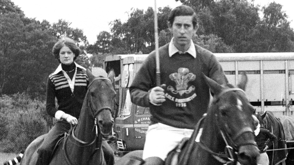 Sarah Spencer and Prince Charles riding horses in 1977