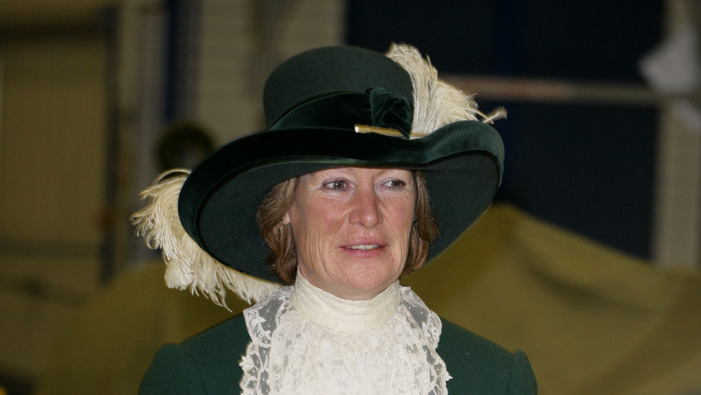 Sarah Spencer in a green and white outfit