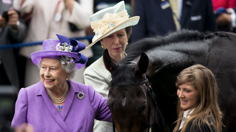 The Queen and Princess Anne with horse