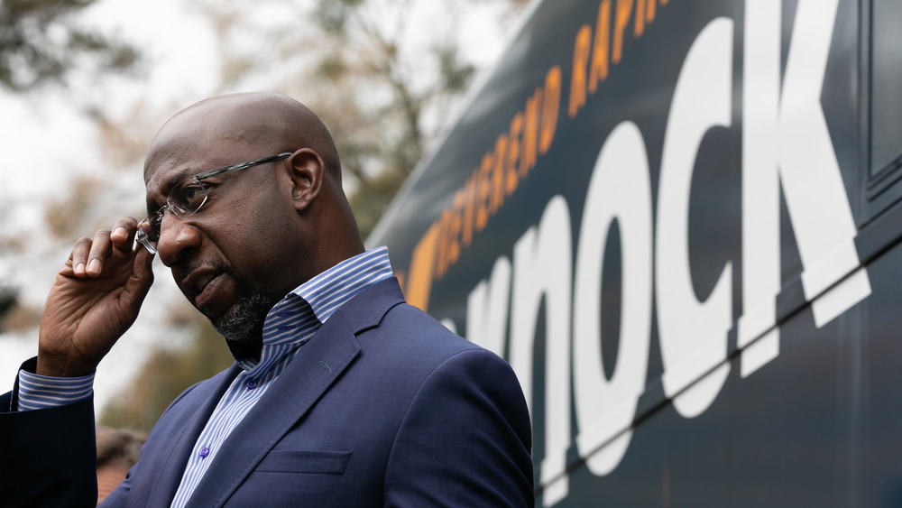 Raphael Warnock in navy blue suit 