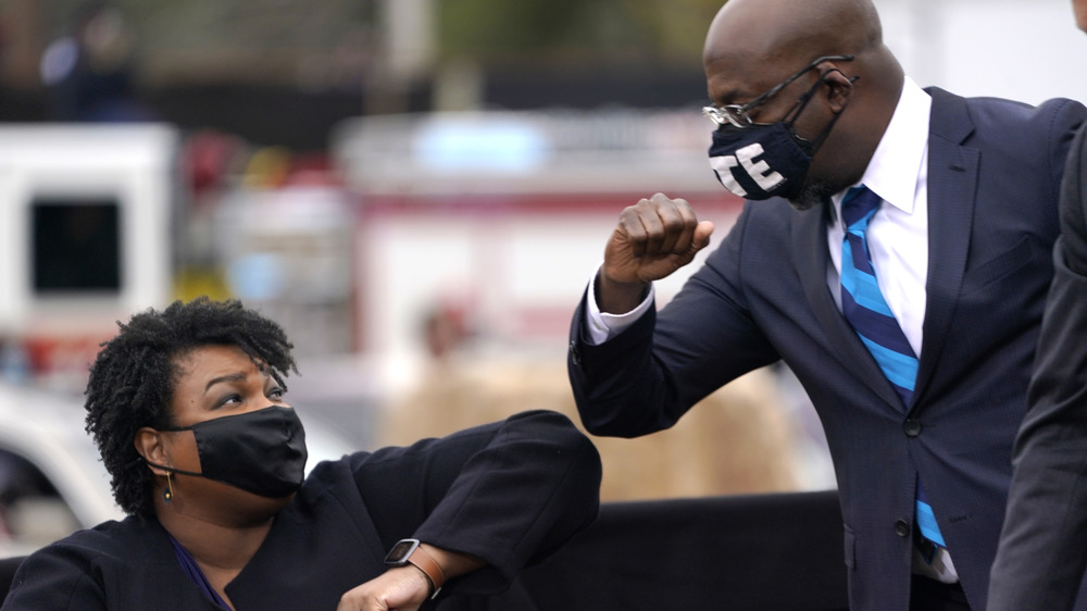 Raphael Warnock with Stacey Abrams 