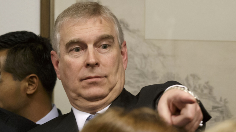 Prince Andrew points a finger