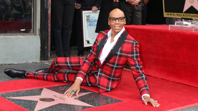 RuPaul posing by his star