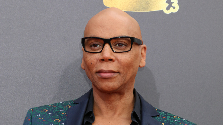 RuPaul posing while wearing glasses