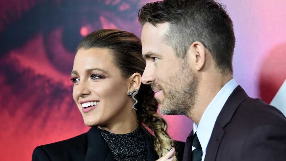 Ryan Reynolds and Blake Lively looking to the side