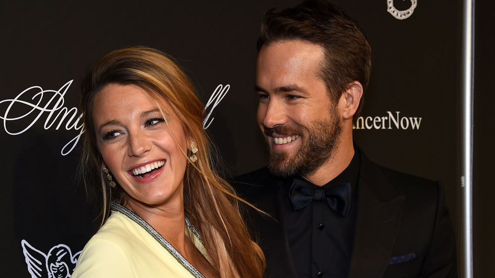 Ryan Reynolds looking at Blake Lively, smiling