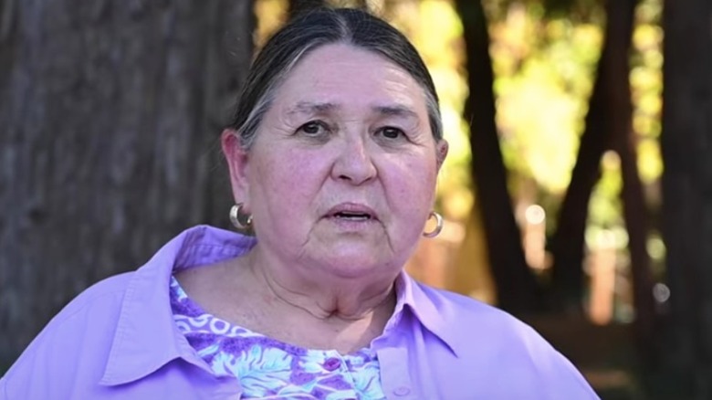 Sacheen Littlefeather wearing purple 