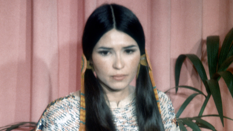 Sacheen Littlefeather in blue earrings 