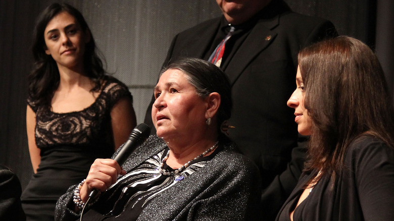 Sacheen Littlefeather speaking on mic