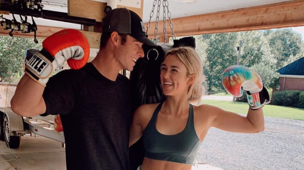 Sadie Robertson and Christian Huff wearing boxing gloves