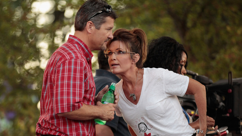 Todd and Sarah Palin outside