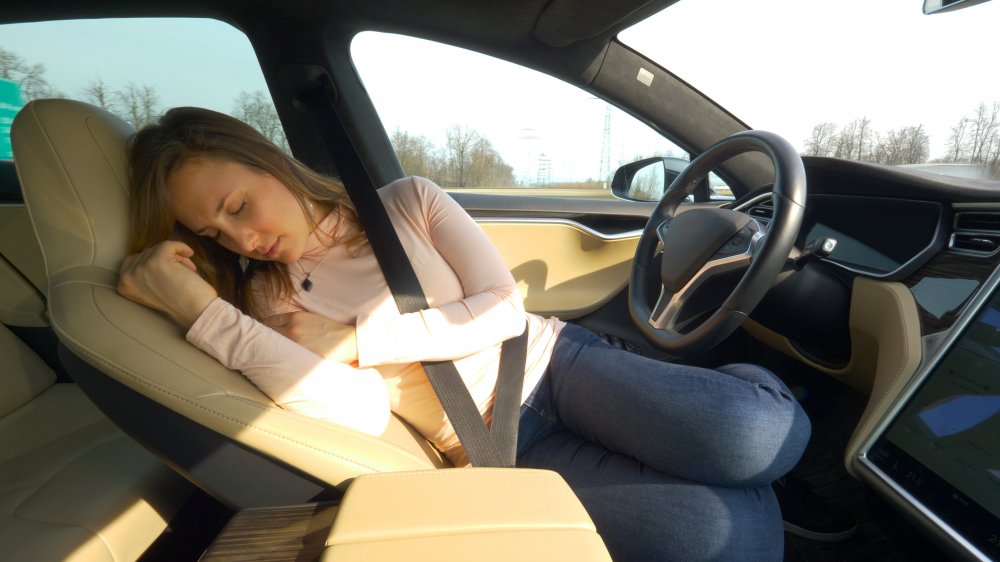 woman napping in car