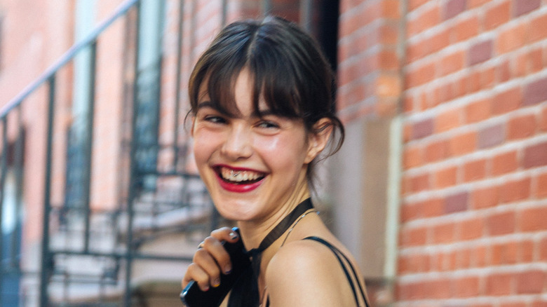 Woman wearing a smiley piercing