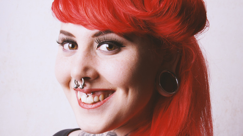 woman with smiley piercing