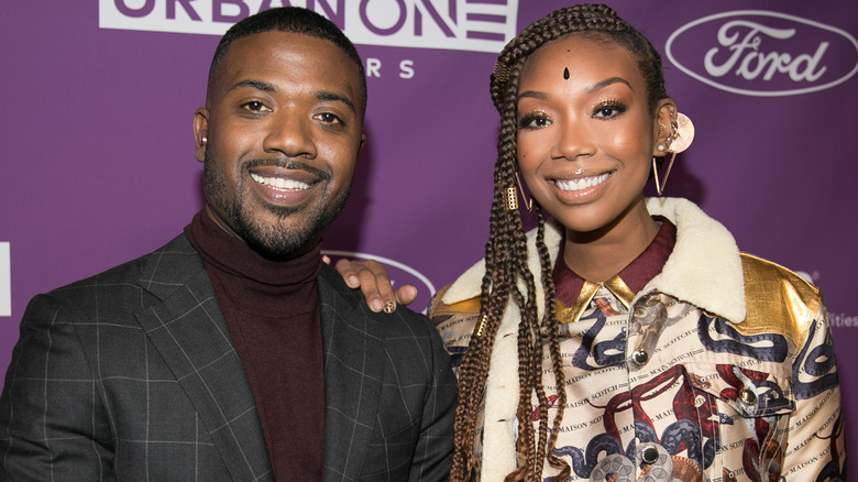 Ray J and Brandy posing for pictures