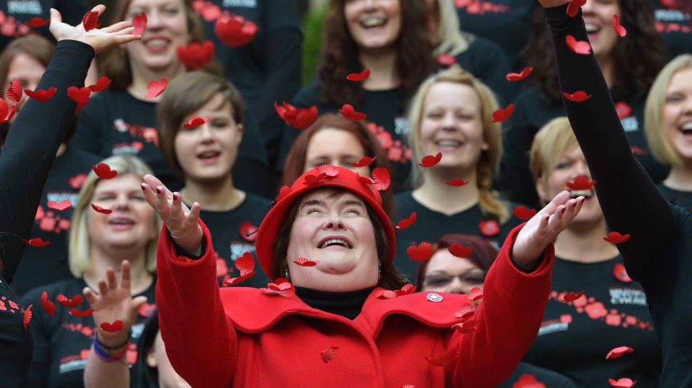 happy Susan Boyle in red