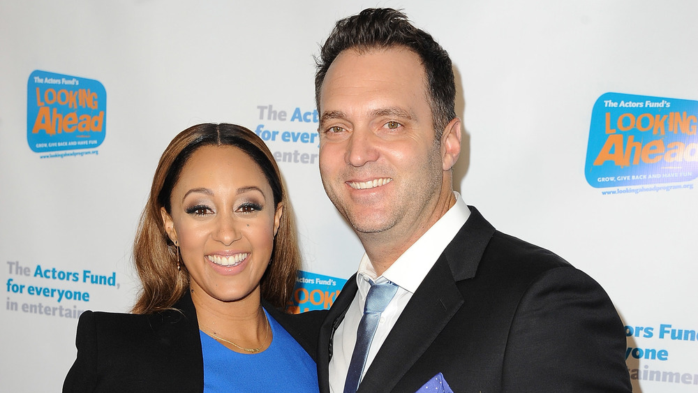 Tamera Mowry and Adam Housley at an event in 2014