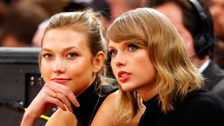 Taylor Swift and Karlie Kloss sitting