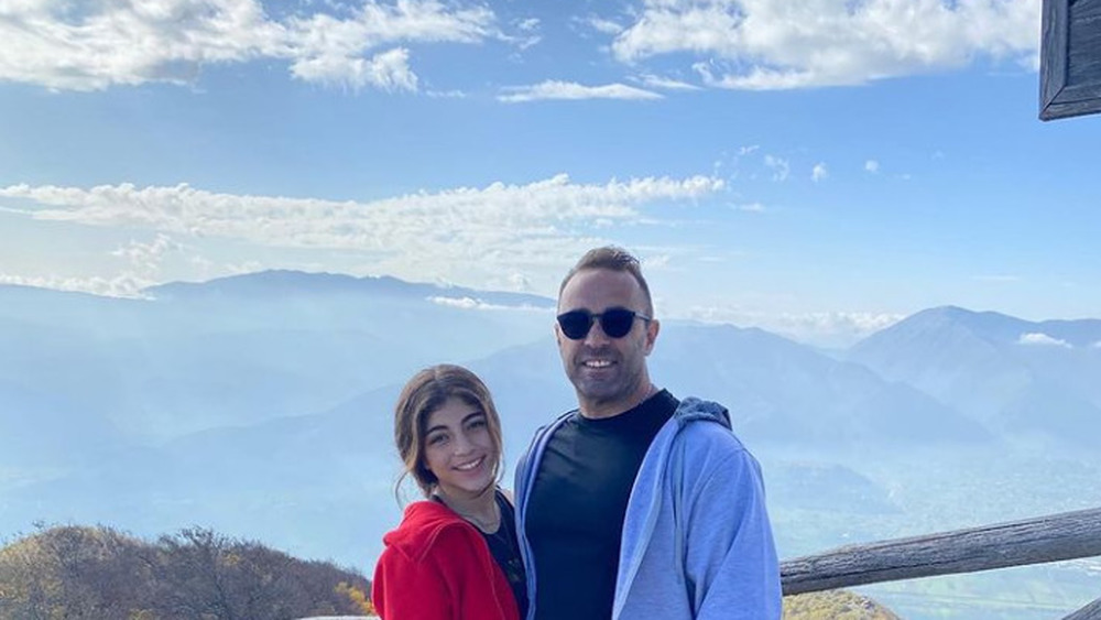 Melania Giudice posing outside with her father, Joe 