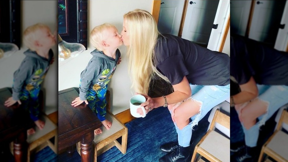 Lacey Hester kissing her son