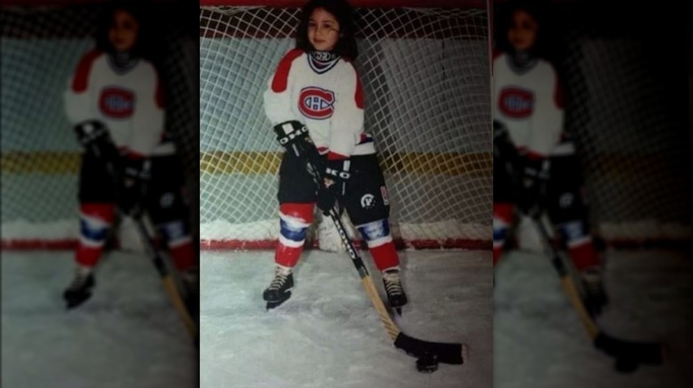 Catherine McBroom as a girl playing hockey