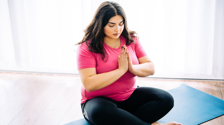 plus size woman doing yoga