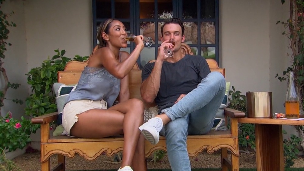 Ben Smith and Tayshia Adams having wine on The Bachelorette