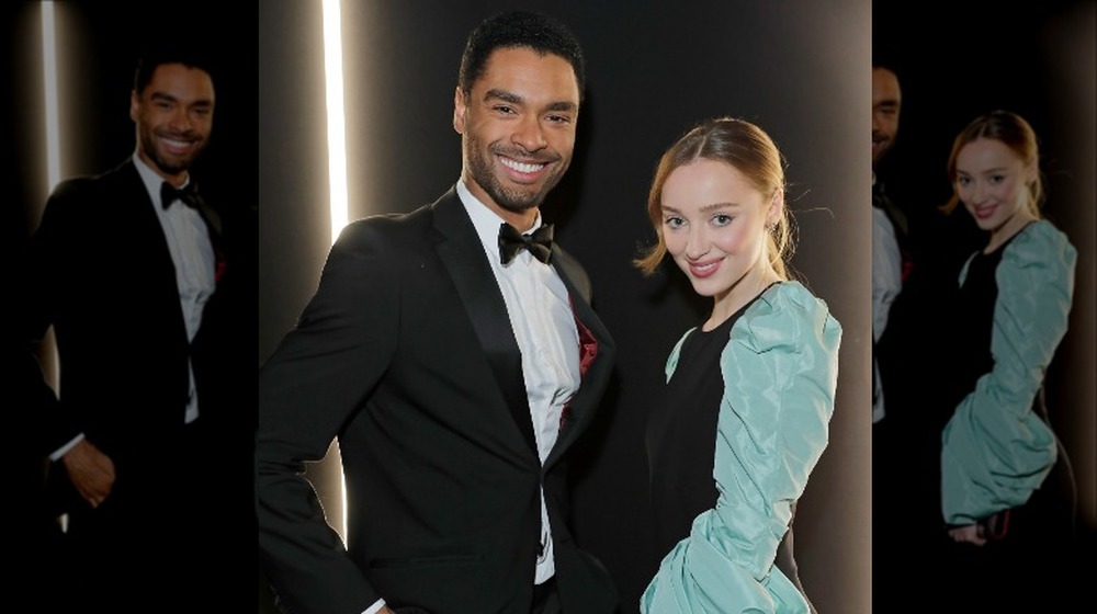 Phoebe Dynevor and Regé-Jean Page from Bridgerton, smiling